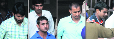 (From left) Dismissed constables Akshay, Himmat Singh, Jagtar (in blue T-shirt), Sunil and Anil come out of the District Courts after their acquittal in Chandigarh on Tuesday.