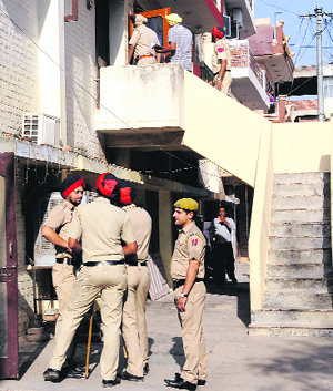 The police conduct a door-to-door search to get clues in the murder case in Phase IX, Mohali.