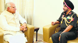 Chief Minister Manohar Lal Khattar meets Lt-Gen KJ Singh, General Officer Commanding-in-Chief, Western Command, at his residence in Chandigarh on Tuesday. A Tribune photograph
