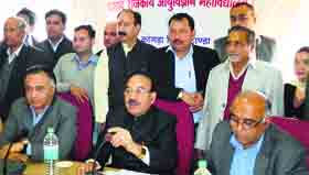 Health Minister Kaul Singh Thakur addresses a prss conference at the DRPGMC in Tanda on Tuesday.