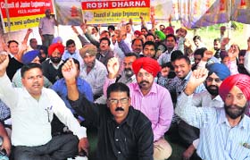 Council of Junior Engineers stage protest outside the Shakti Sadan in Jalandhar on Tuesday