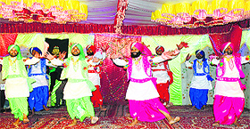  CRPF personnel perform bhangra during a cultural programme at their headquarters in Pulwama 