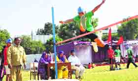 A student attempts a high jump during the annual athletics meet at Guru Nanak Public School in Ludhiana on Monday.