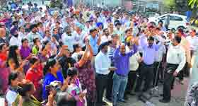 Bankers protest in front of the State Bank of India in Ludhiana.