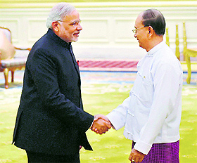 PM Narendra Modi shakes hands with Myanmar President U Thein Sein during a meeting at Nay Pyi Taw on Tuesday.