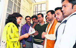 Members of the Bharatiya Janata Yuva Morcha submit memorandum to ADM Jharna Kamthan at the District Magistrate office in Dehradun on Tuesday. 