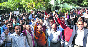 Administrative staff of the state Secretariat protest in support of their demands in Dehradun on Tuesday
