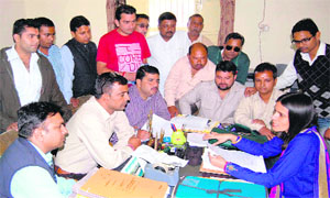 Mukhya Nagar Adhikari Vipra Trivedi listens to the grievance of ward councillors against the allocation of flower vending zones at her office in Haridwar on Tuesday. 