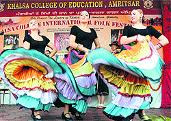 Folk artistes from Slovakia perform dances at the International Folk Festival at Khalsa Collage in Amritsar on November 12