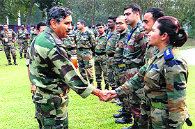 Lt Gen Arun Kumar Sahni, General Officer Commanding-in-Chief, Sapta Shakti, greets a woman officer in Bathinda on Wednesday.