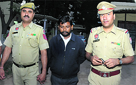 The accused, Ram Bilas, in police custody at the Phase XI police station in Mohali on Wednesday. 