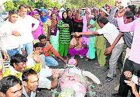 Protesting MC workers raise slogans in Panchkula on Wednesday. 