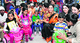 Members of Small Wonders School, Mohali, and NGO Nanhi Jaan spend time with children at the paediatric ward of the PGI, Chandigarh, on Wednesday. 