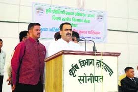 Dr Sanjiv Balyan, Union Minister of State for Agriculture and Food Processing, addresses farmers during a kisan mela in Rai on Wednesday