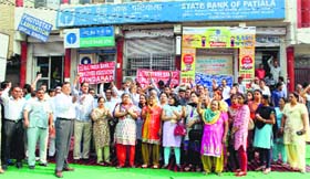 Members of the Haryana Bank Employees Union stage a dharna in Gurgaon on Wednesday