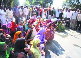 Jatheri villagers block the Bilaspur-Jagadhri road in Yamunanagar on Wednesday