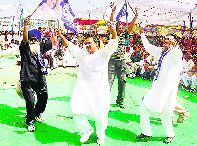 BSP party workers break into a jig during the Jan Hit Chetna Rally at the Parade Ground in Jammu. 