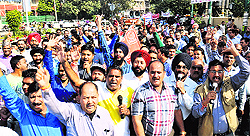 Workers of the United Forum of Bank Union observe a march in Jalandhar on Wednesday