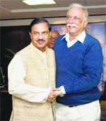 Union Minister for Civil Aviation Ashok Gajapathi Raju Pusapati greets Minister of State for Civil Aviation Mahesh Sharma as he takes charge in New Delhi on Wednesday.