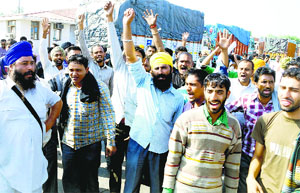 Traders and truck drivers hold a protest at Shambhu barrier on Wednesday