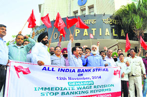 Members of the United Forum of Bank Unions protest in Patiala on Wednesday.