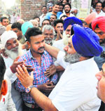 Deputy CM Sukhbir Badal greets people at Arniwala village in Jalalabad on Wednesday