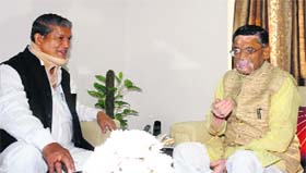 Chief Minister Harish Rawat meets Union Textile Minister Santosh Gangwar in New Delhi on Wednesday