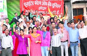 Protesters under the United Forum of Bank Union raise slogans in support of their demands in Haridwar