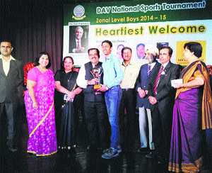 Skater Chirag Gupta receives an award from Tarun Chugh at DAV National Sports Tournament.