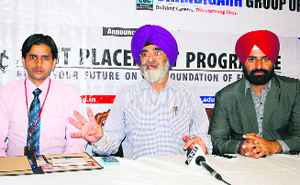 Dr RS Bawa, Vice Chancellor of Chandigarh University (centre), announces the launch of a web portal for joint placement for Punjab students in Amritsar on Monday.