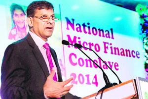 RBI Governor Raghuram Rajan speaks during the National Micro Finance Conclave 2014 at NABARD in Mumbai on Thursday.