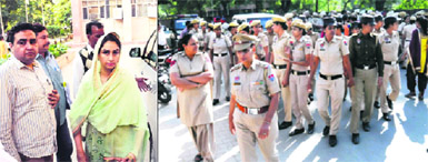 Union Minister Harsimrat Kaur Badal during her visit; and (right) police force deployed on VIP duty in Bathinda on Thursday