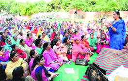 Hargobind Kaur, president, Anganwari Workers Union, addresses a dharna in Bathinda on Thursday