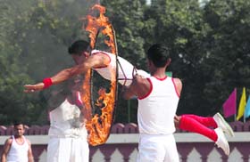 DAREDEVIL ACT: A trainee of the Indo-Tibetan Border Police displays his skills during the passing-out parade at Bhanu in Panchkula on Thursday