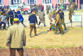 Policemen disperse NC and PDP supporters in Kulgam district on Thursday