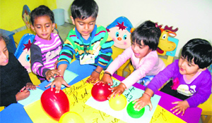 Tiny tots take part in an activity to mark Traffic Rules Day at Childhood Kindergarten Playway School in Ludhiana on Thursday.