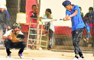 A player in action during a match of the baseball championship on Thursday.