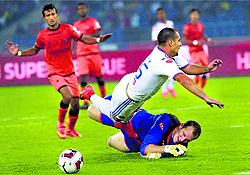 FC Goa and Delhi Dynamos players slugging it out in the Indian Super League match in New Delhi on Thursday