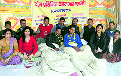 Members of the Yoga Trained Unemployed Union on a fast at Parade Ground in Dehradun on Thursday in support of demands