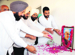 Rural Congress president Gurjeet Singh Aujla and workers of the rural Congress celebrate the birth anniversary of Pt Jawaharlal Nehru at their office in Amritsar on Friday.