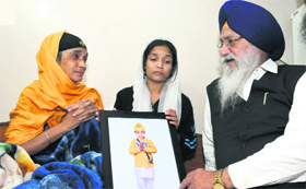 SGPC president Avtar Singh Makkar meets Mehrams mother (centre) and maternal grandmother at their residence in Phase IX, Mohali, on Friday.