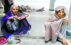 Two elderly women await their turn for enrolment for Aadhaar cards at the Kurukshetra Mini-Secretariat