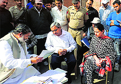 Health Minister Anil Vij scrutinises the records of the district Food and Supplies Department in Ambala Cantt on Friday