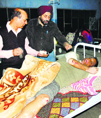 Senior manager of the Central Bank of India, Bhagat Goyal, who was attacked, undergoing treatment at the Civil Hospital in Jalandhar on Friday.