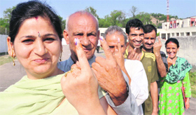 Displaced Kashmiri Pandit voters at Jagti migrant camp in Nagrota.