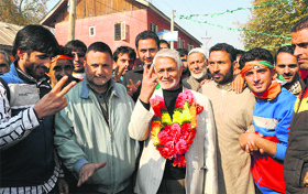 Congress leader Mohammad Yasin Bhat with his supporters in Kupwara district on Friday after filing his nomination papers.
