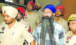 Ramandeep Singh (alias Goldy) being taken to a court in Patiala on Friday.