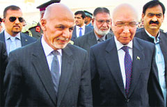 Pakistans adviser on National Security and Foreign Affairs Sartaj Aziz (R) greets Afghan President Ashraf Ghani at Chaklala airbase in Rawalpindi on Friday. AP/PTI