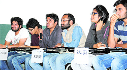 Students take part in a quiz at Panjab University on Saturday