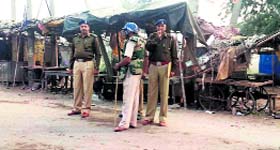 Cops patrol a street in Hathin on Saturday